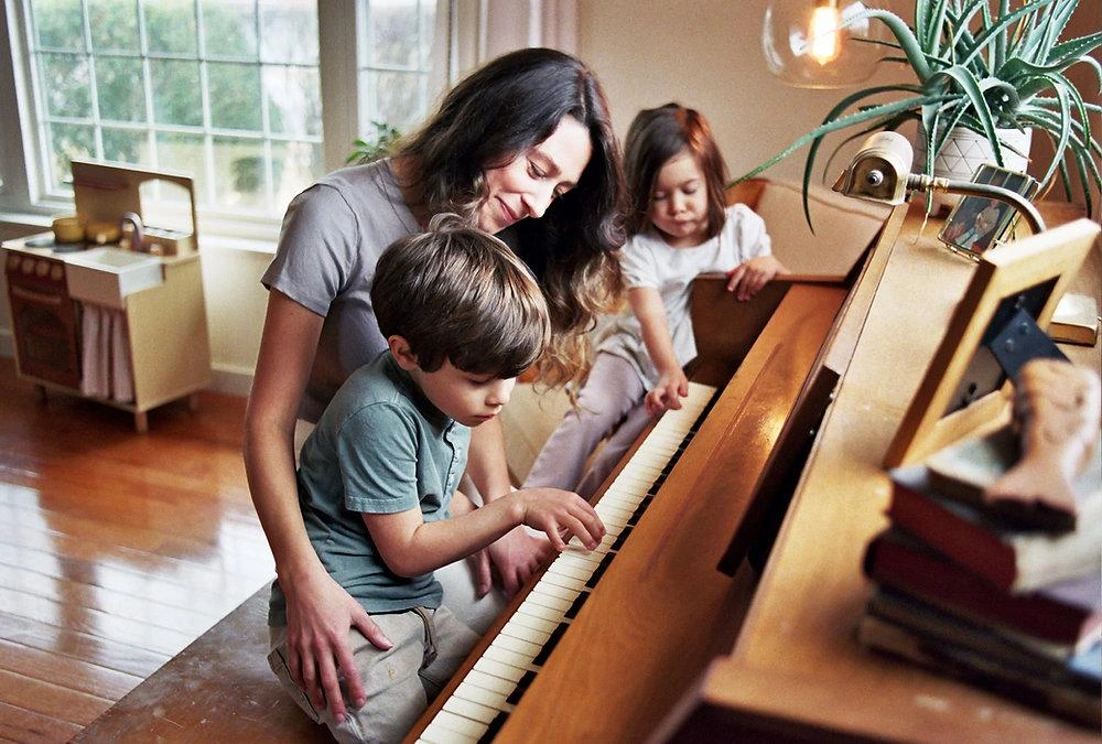 Child playing music instrument, apply for in-home lessons