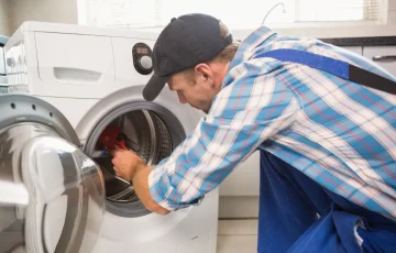 handyman-fixing-washing-machine handyman-fixing-washing-machine