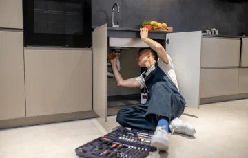 household-repair-middle-aged-man-inspecting-pipe-touching-hand-sink-stylish-modern-kitchen household-repair-middle-aged-man-inspecting-pipe-touching-hand-sink-stylish-modern-kitchen